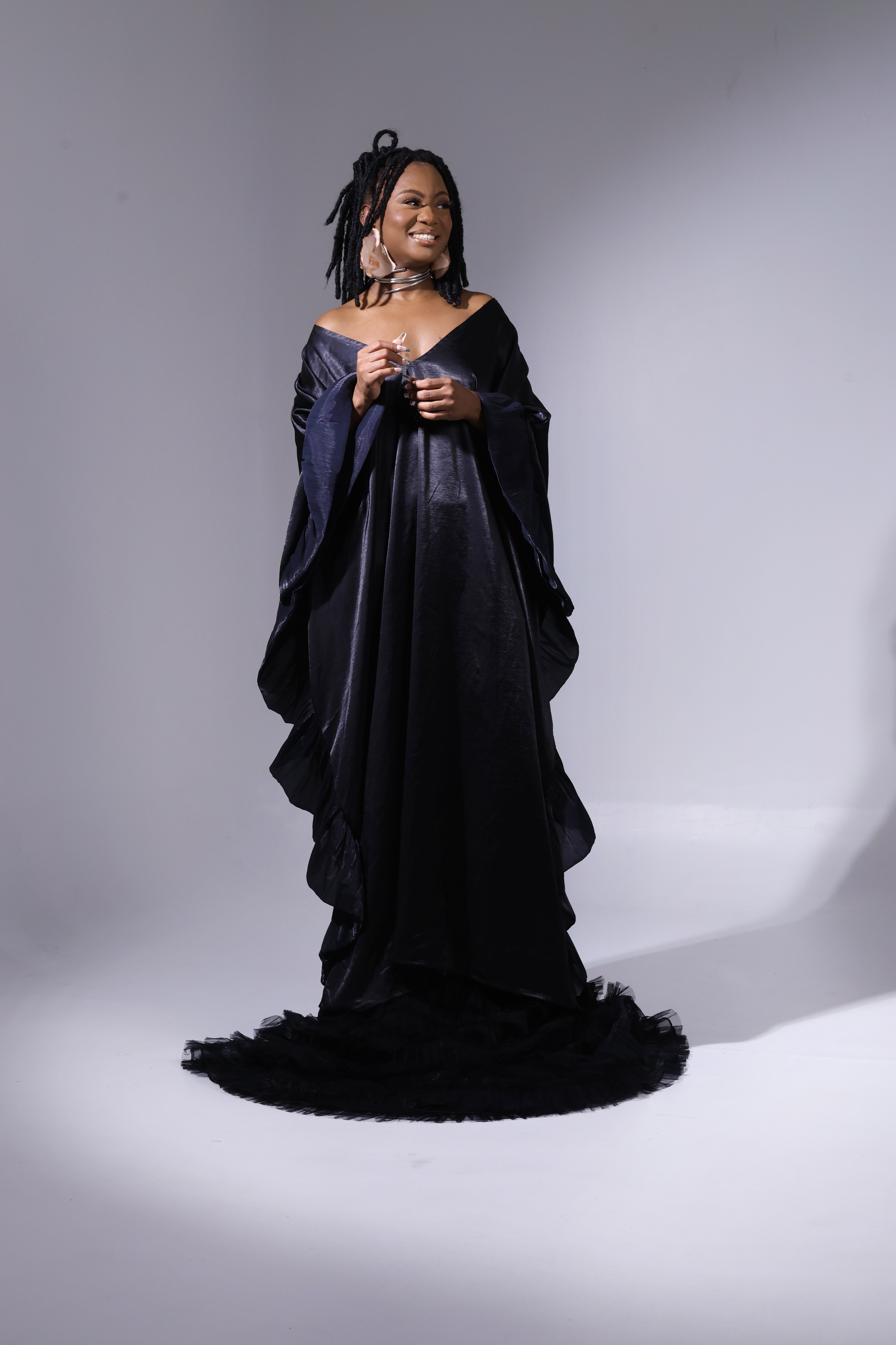 Studio portrait in a black gown